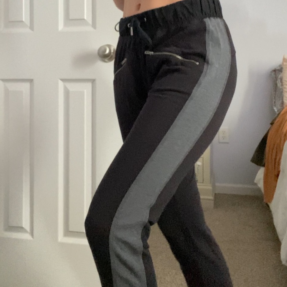 Black joggers with zipper pockets